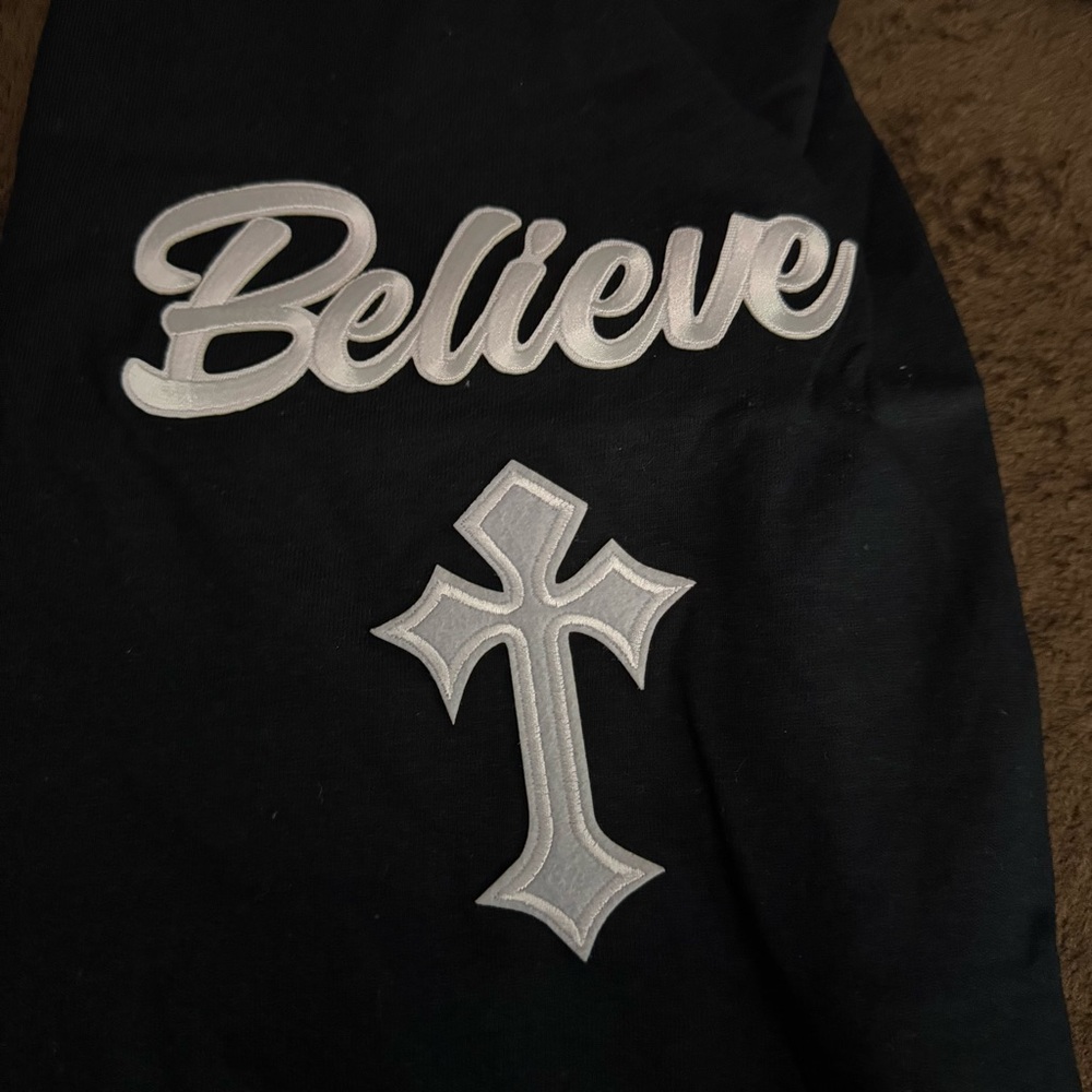 Black Tee with White 'Believe' and Cross Design